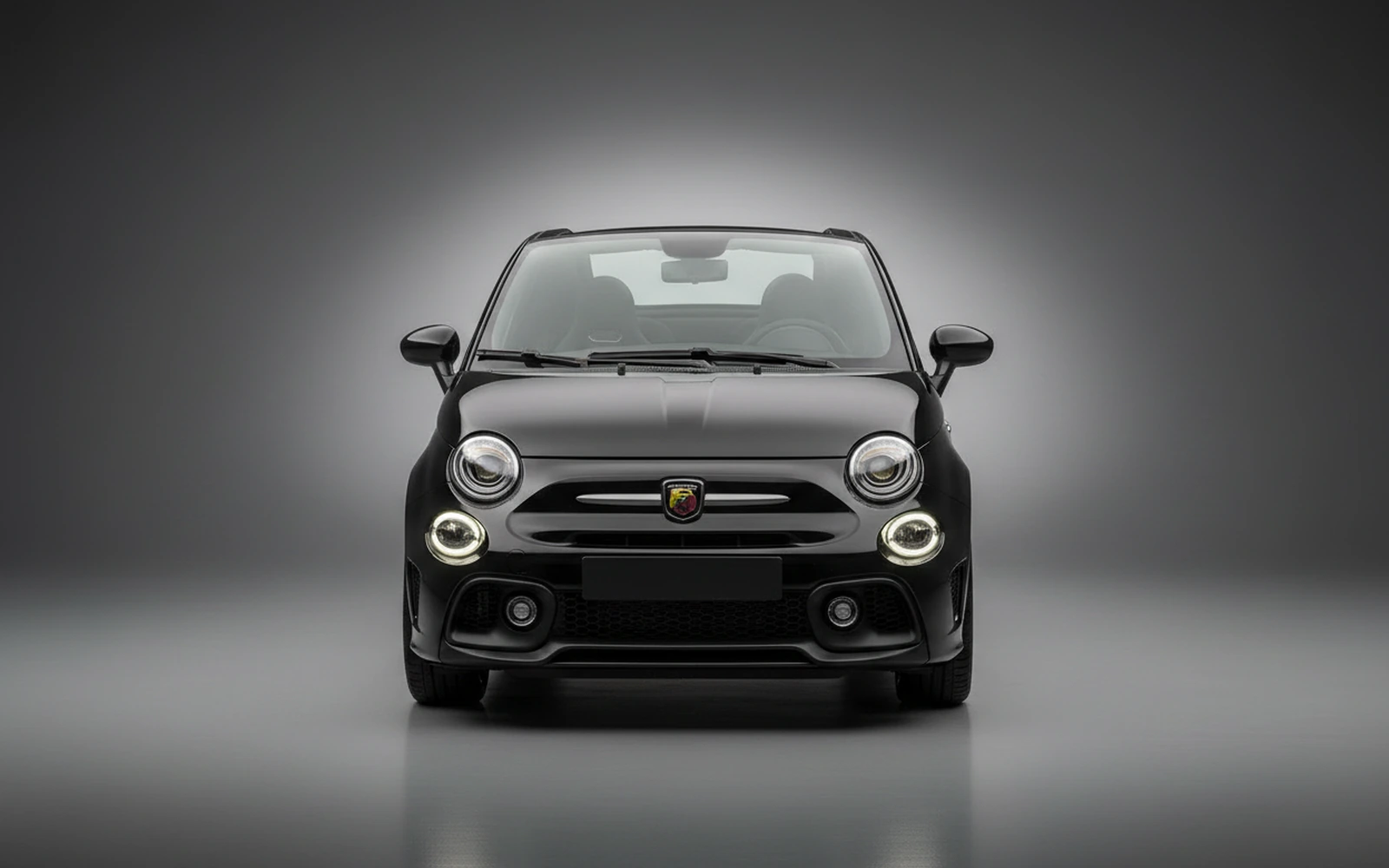 Abarth 695 Turismo Black 2023 — exterior side view