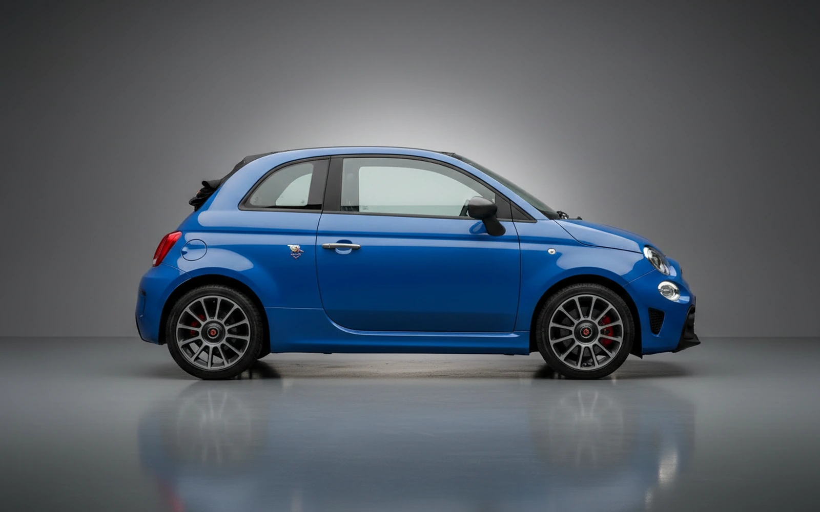 Abarth 695 Turismo Blue 2023 — exterior rear view