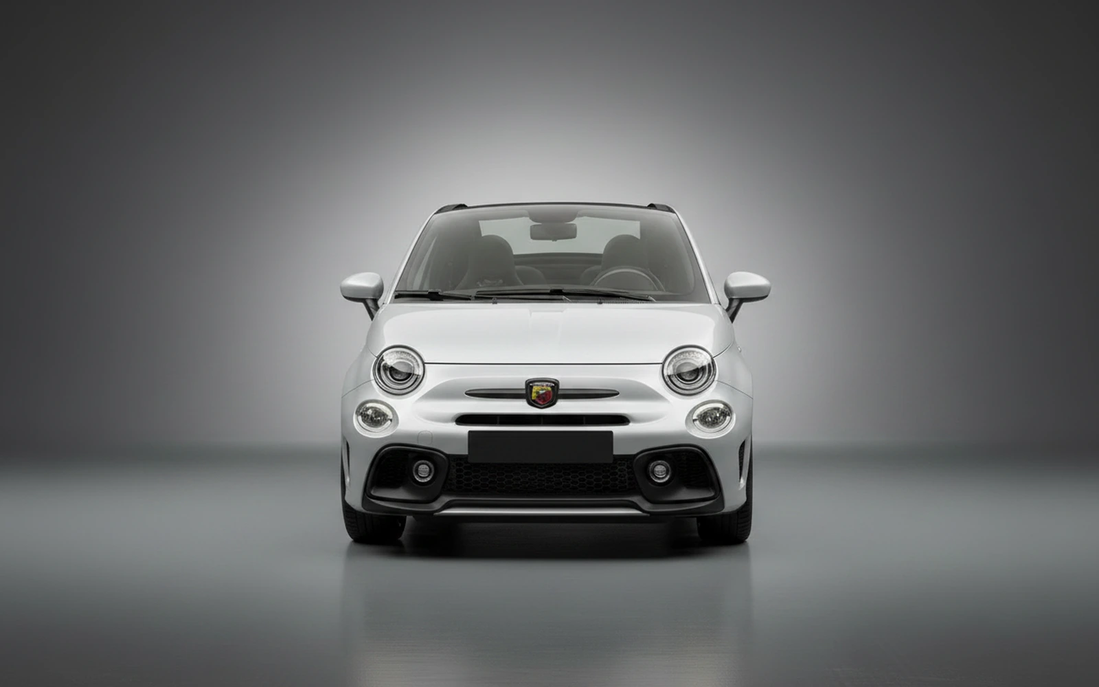 Abarth 695 Turismo Silver 2023 — exterior side view