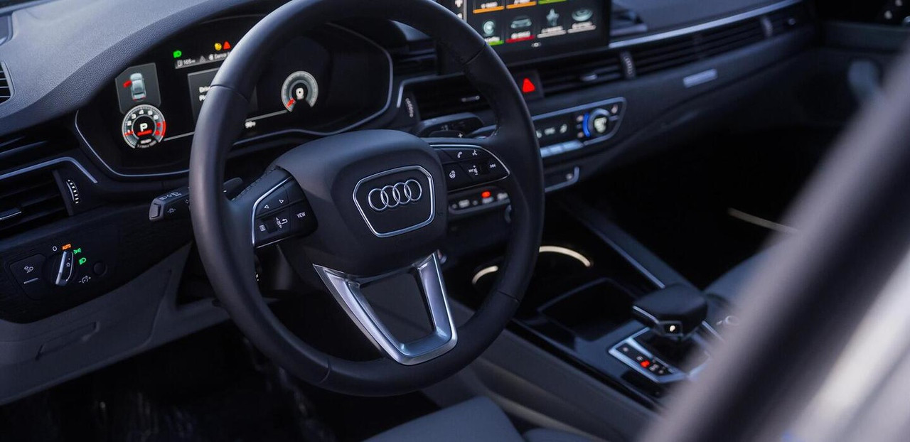 Audi A4 Grey 2023 — exterior side view