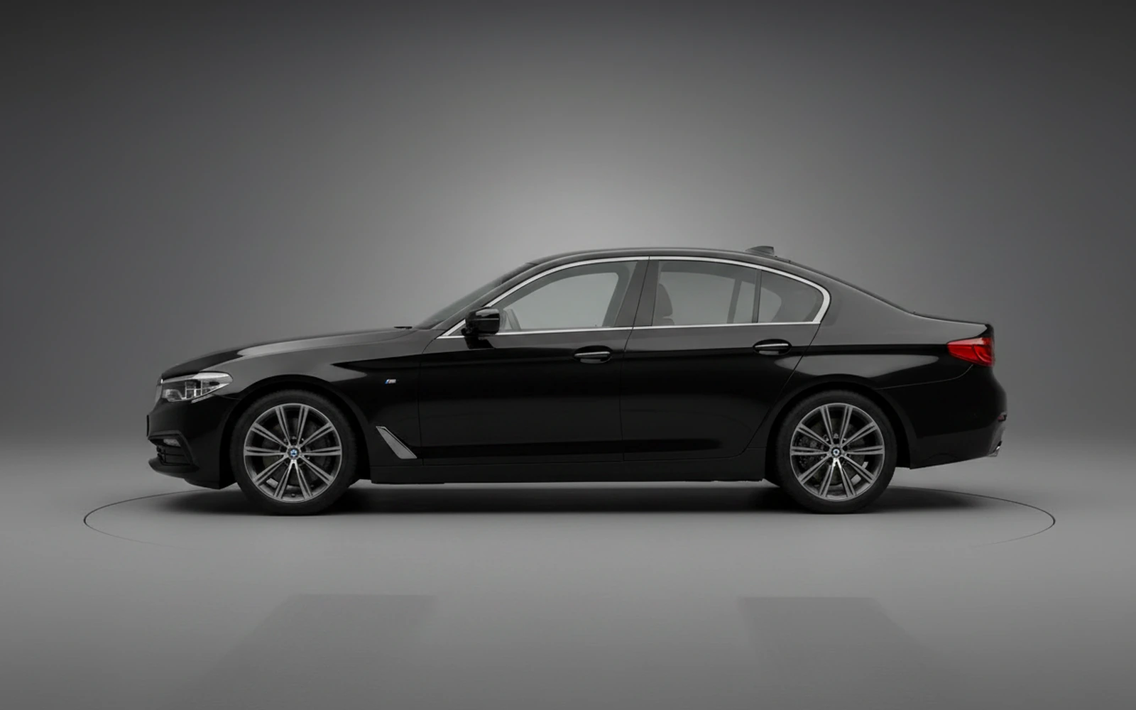 BMW 520i Black 2023 — exterior rear view