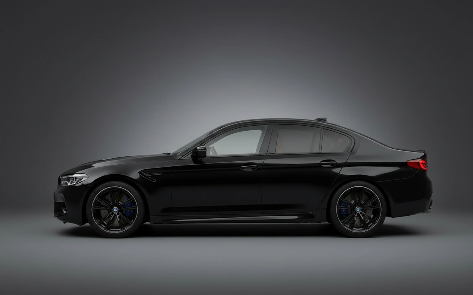 BMW M5 Competition Black 2023 — exterior rear view