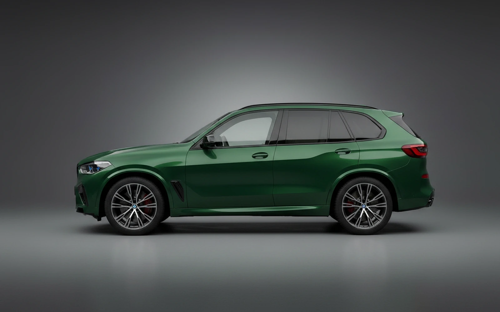 BMW X5m Competition Green 2024 — exterior rear view