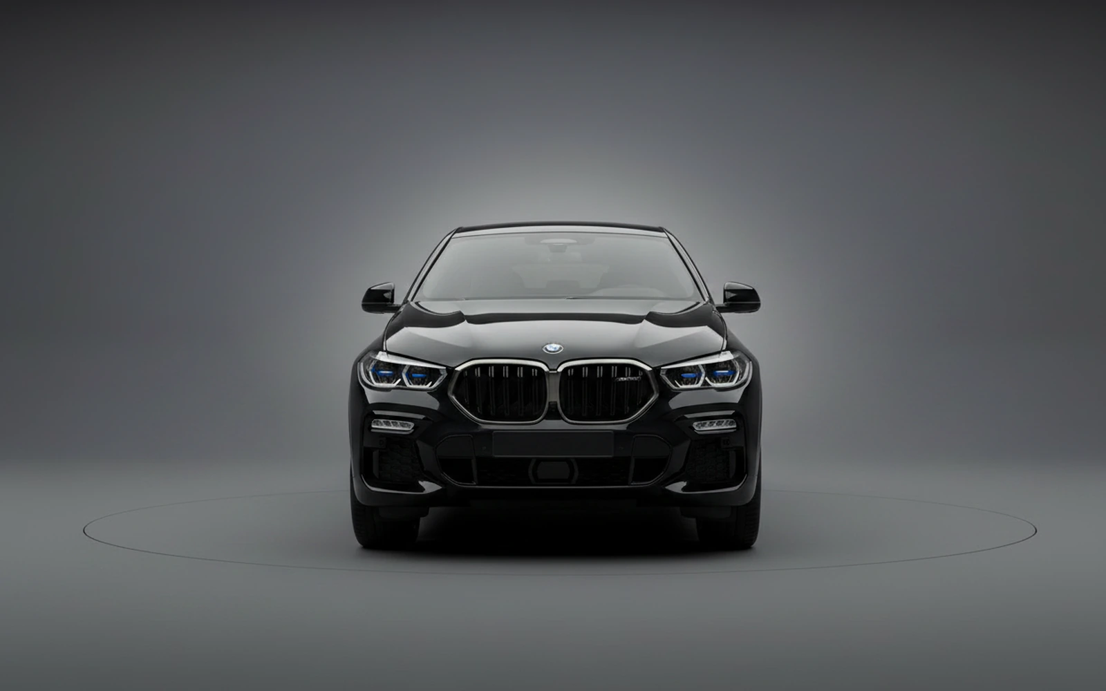 BMW X6 xDrive40i Black 2024 — exterior side view