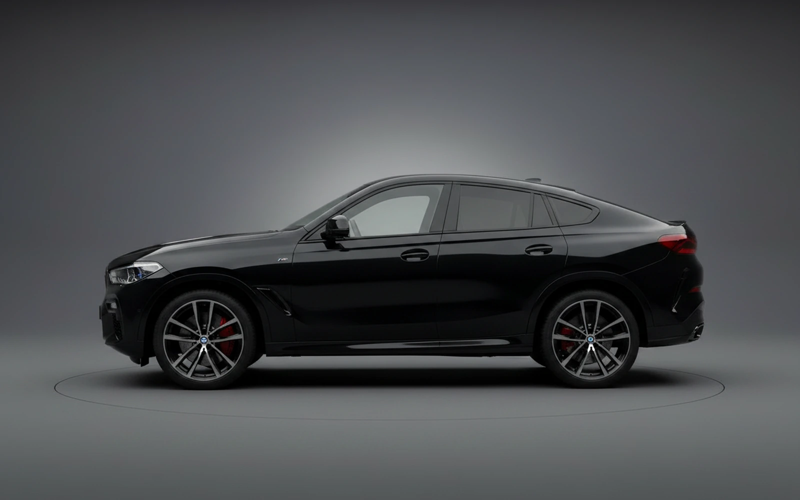 BMW X6 xDrive40i Black 2024 — exterior rear view
