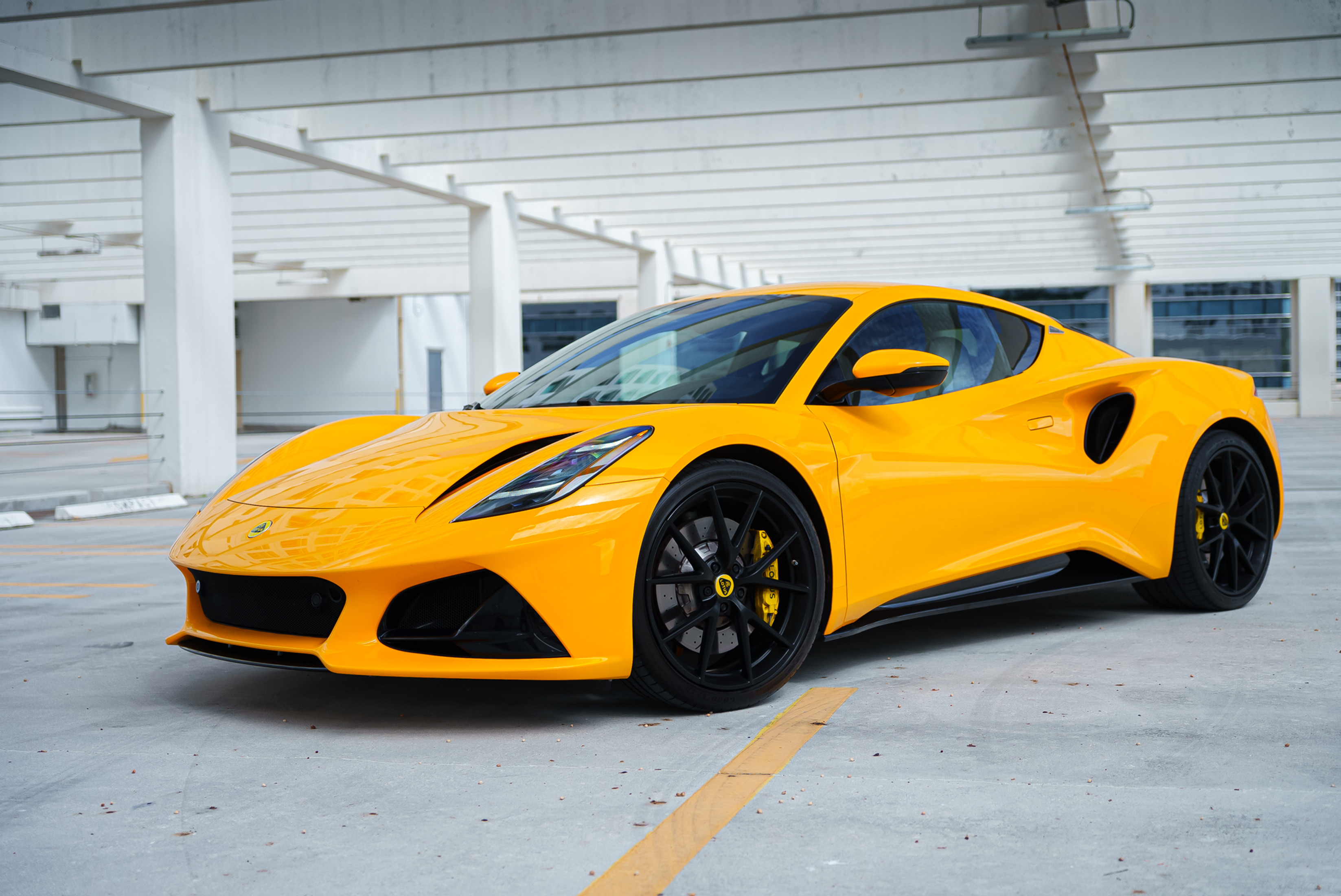 Lotus Emira Yellow — exterior side view
