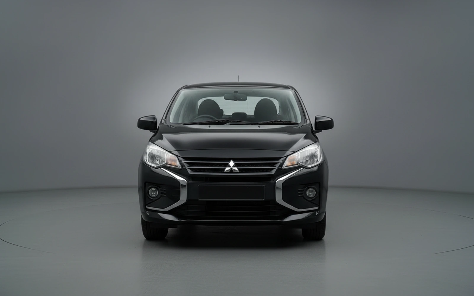 Mitsubishi Attrage Negro 2026 — exterior side view