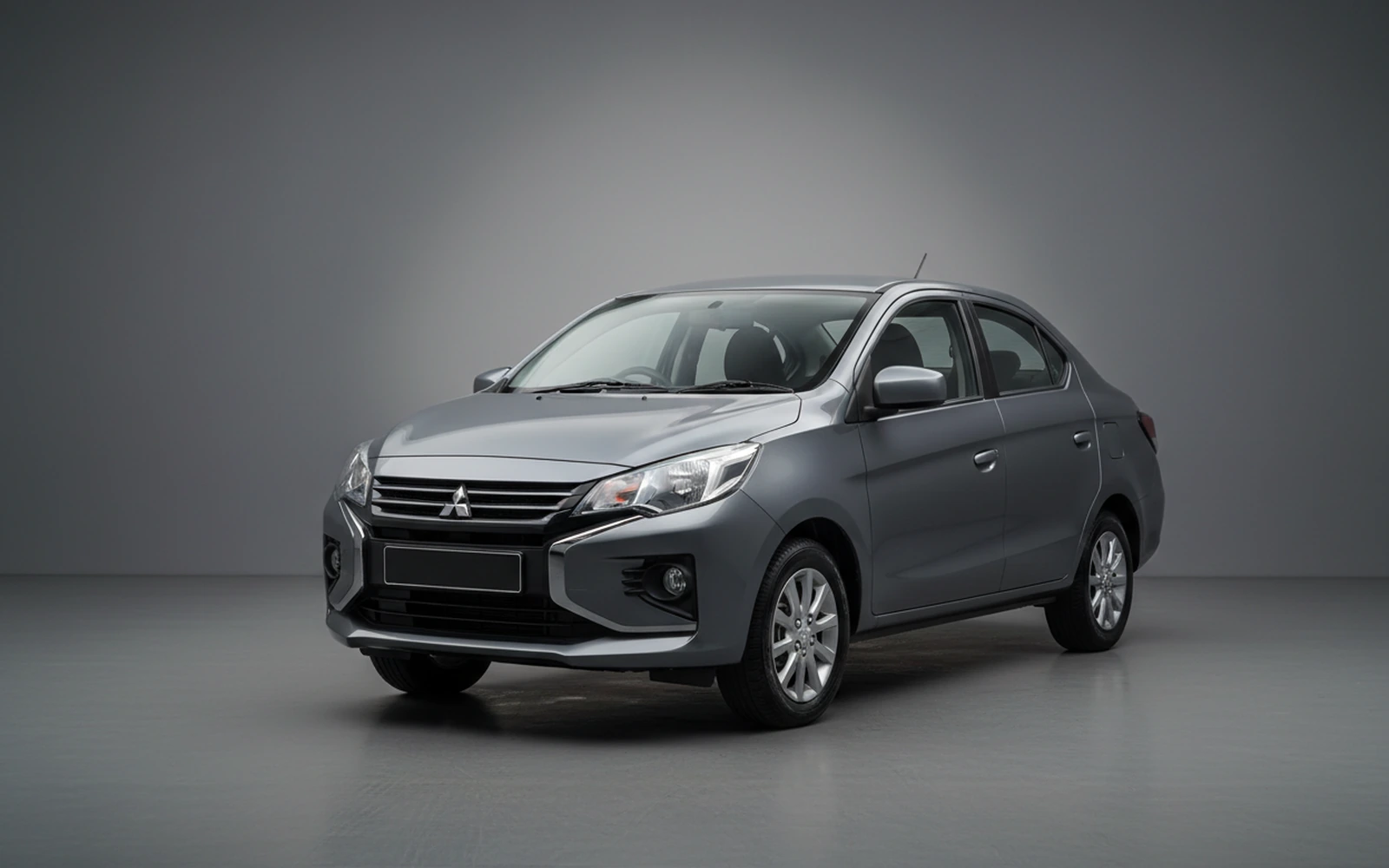 Mitsubishi Attrage Grey 2026 for rent in Miami — exterior front view