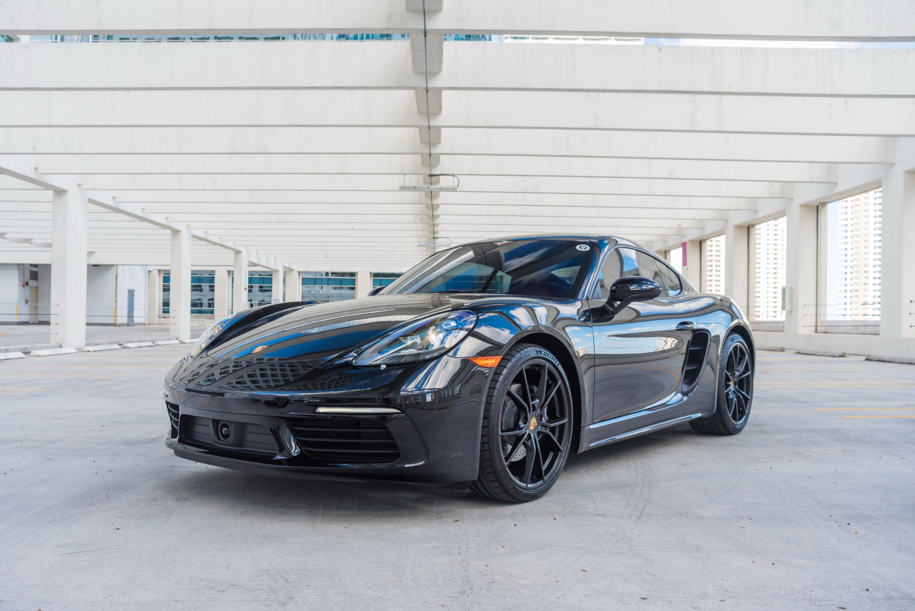 Porsche 718 Cayman White for rent in Miami — exterior photo