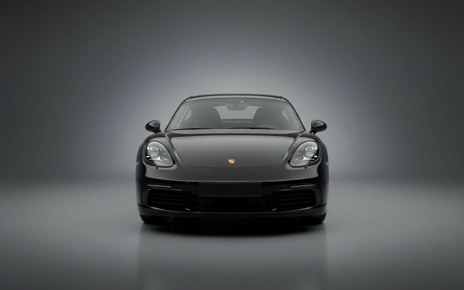 Porsche Cayman Negro 2024 — exterior side view