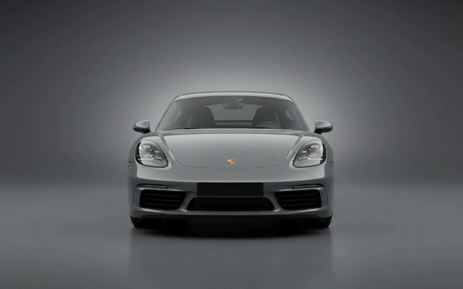Porsche Cayman Grey 2024 — exterior side view