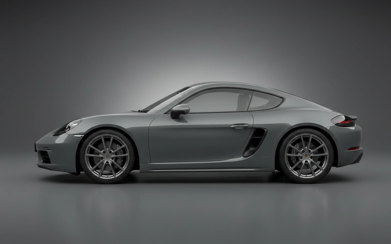 Porsche Cayman Grey 2024 — exterior rear view